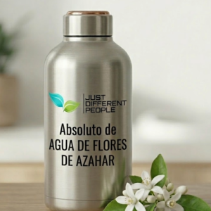 Silver metal bottle with brand 'Just Different People' and text 'Absoluto de Agua de Flores de Azahar', beside white jasmine blossoms.