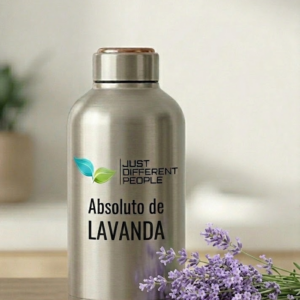 A stainless steel bottle labeled 'Just Different People' with 'Absoluto de LAVANDA' and lavender flowers in the foreground.