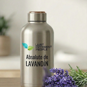 Silver stainless-steel bottle with 'Just Different People' branding and 'Absoluto de Lavandín' text, placed next to a lavender bouquet.