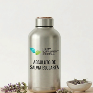 Stainless steel bottle with brand text and two green leaves logo, labeled 'ABSOLUTO DE SALVIA ESCLAREA' on a pale background, with lavender sprigs nearby.